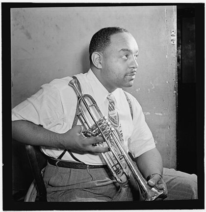 Benny Carter holding a trumpet at the Apollo Theatre, about 1946