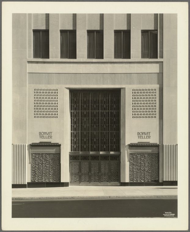 Limestone facade of the Bonwit Teller store with a tall bronze door, carved grilles and the name BONWIT TELLER on either side