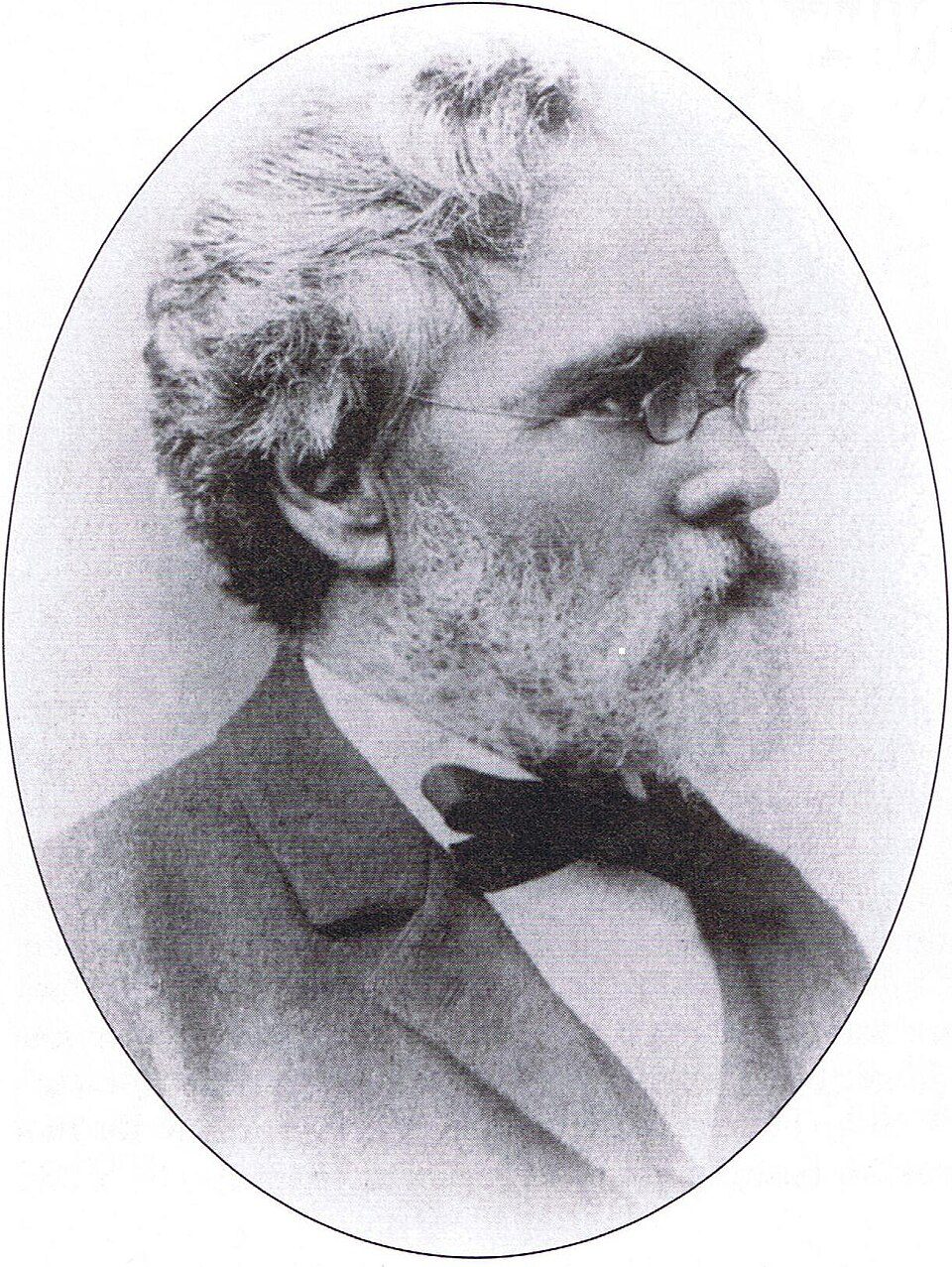 Oval portrait of Calvert Vaux, a bearded man in a bow tie