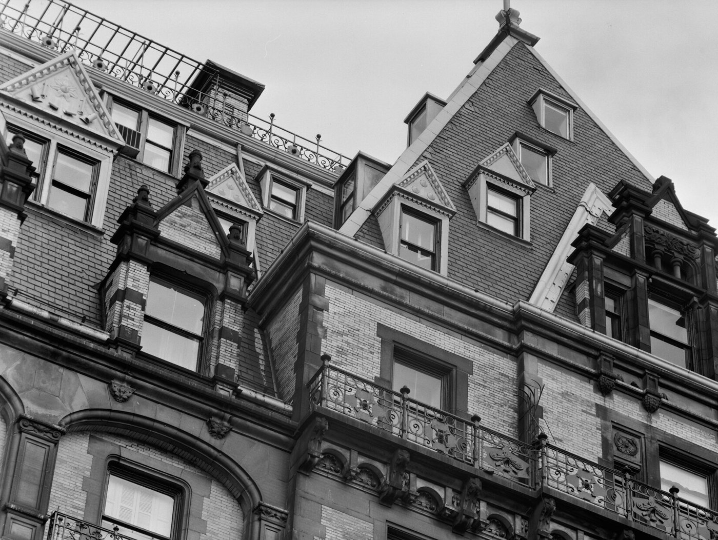 Gables, dormers and iron railings on the Dakota's roofline.