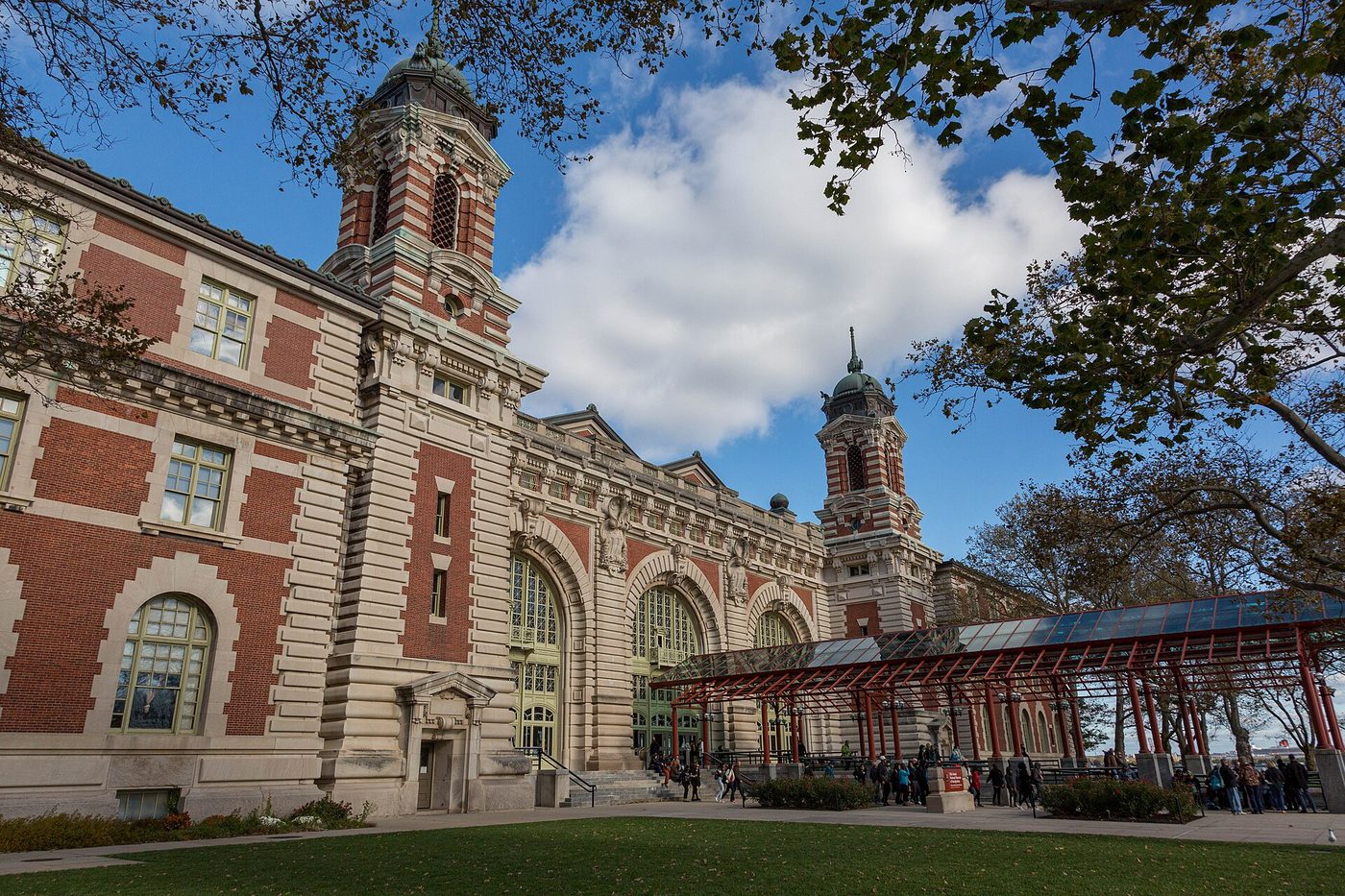 The brick and limestone Main Building on Ellis Island with its copper-roofed corner towers