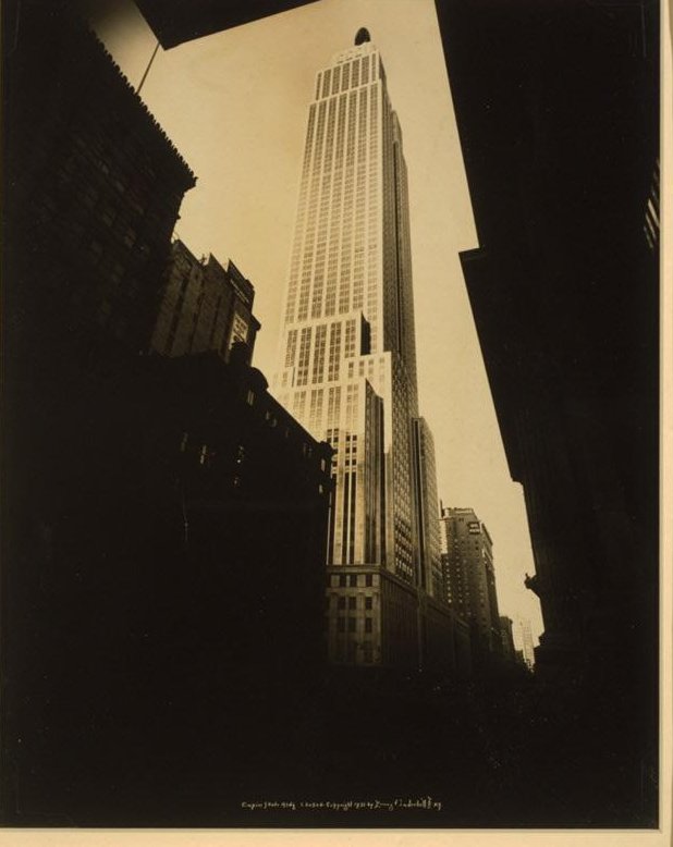 The Empire State Building seen between Midtown buildings in 1931.