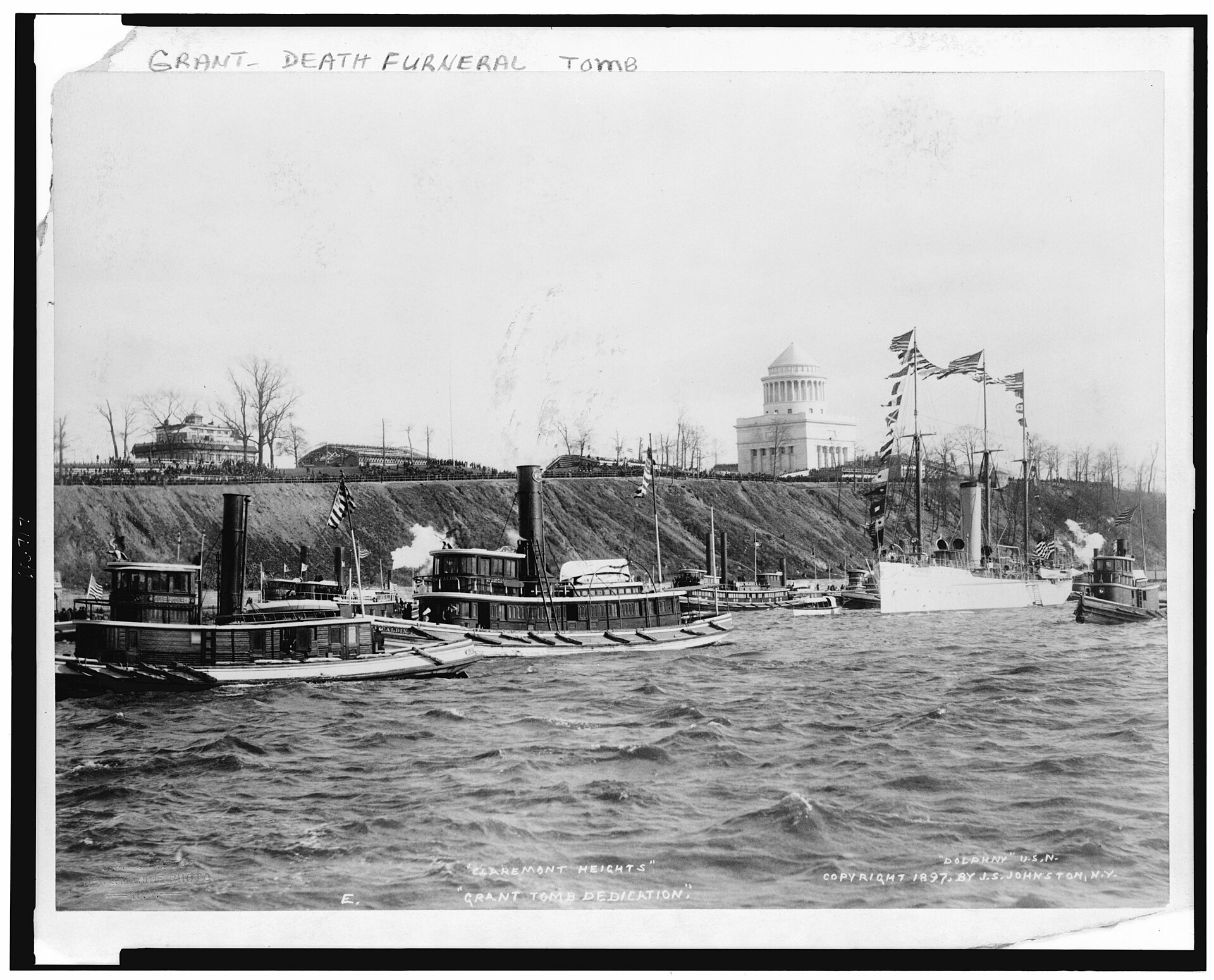 The finished Grant's Tomb on its Riverside bluff on dedication day in 1897, seen from the Hudson River with naval vessels in the foreground