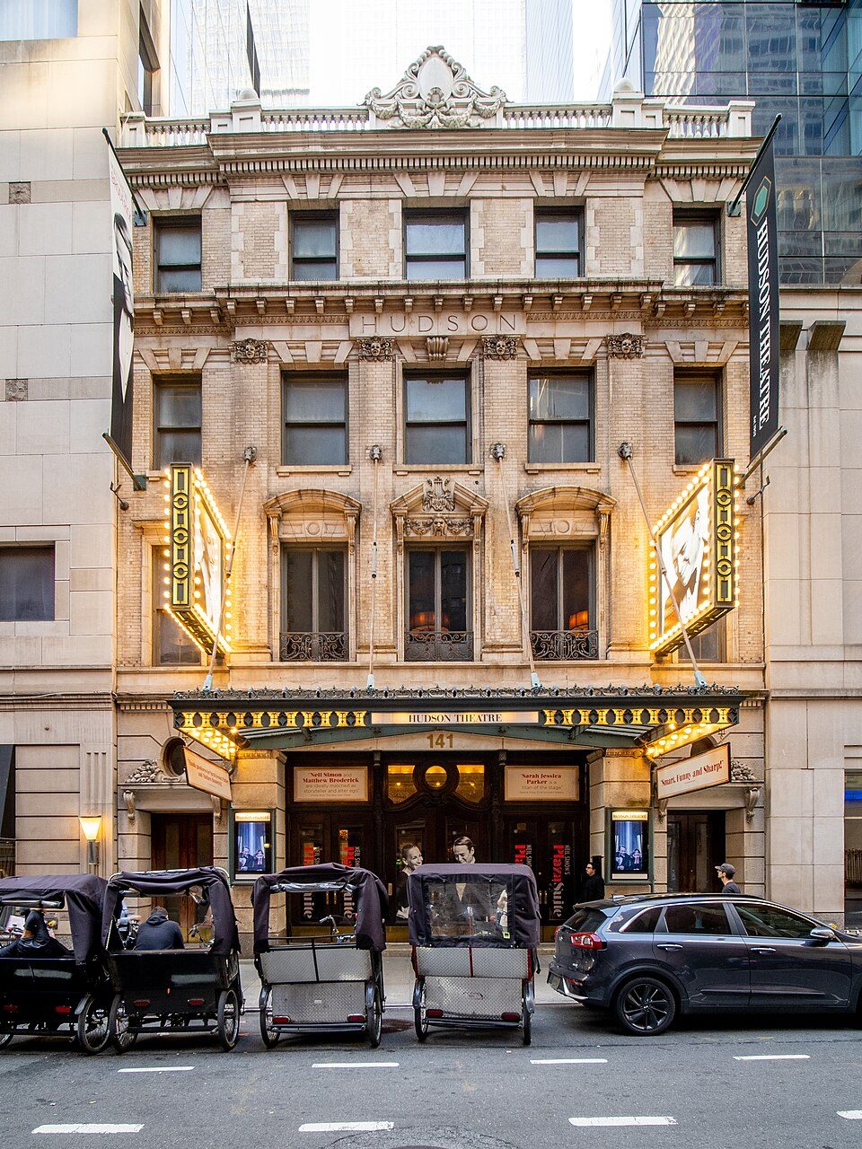 The facade of the Hudson Theatre on West 44th Street in Manhattan with its marquee lit, 2022