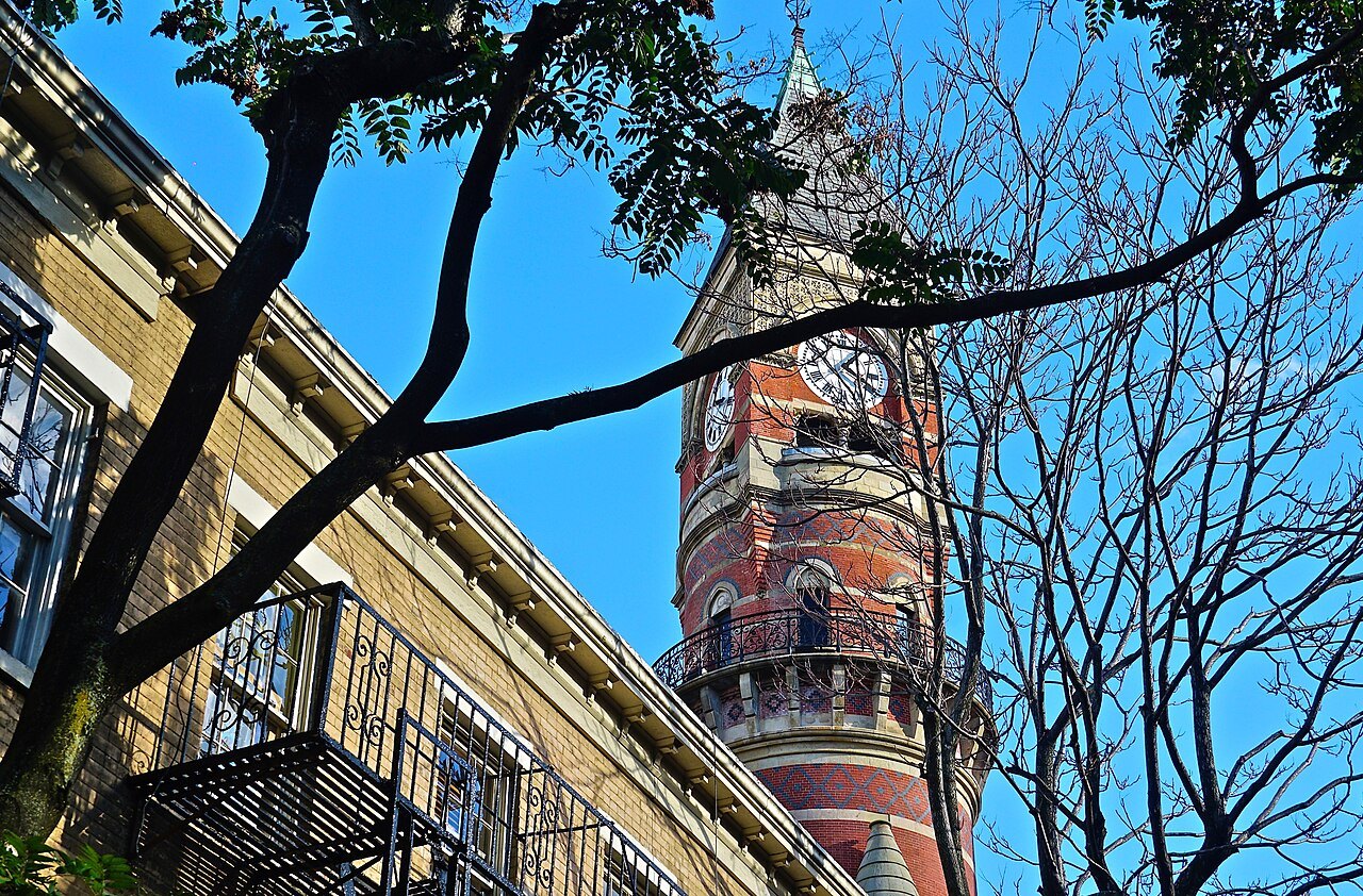 The clock tower seen from Patchin Place in 2018.