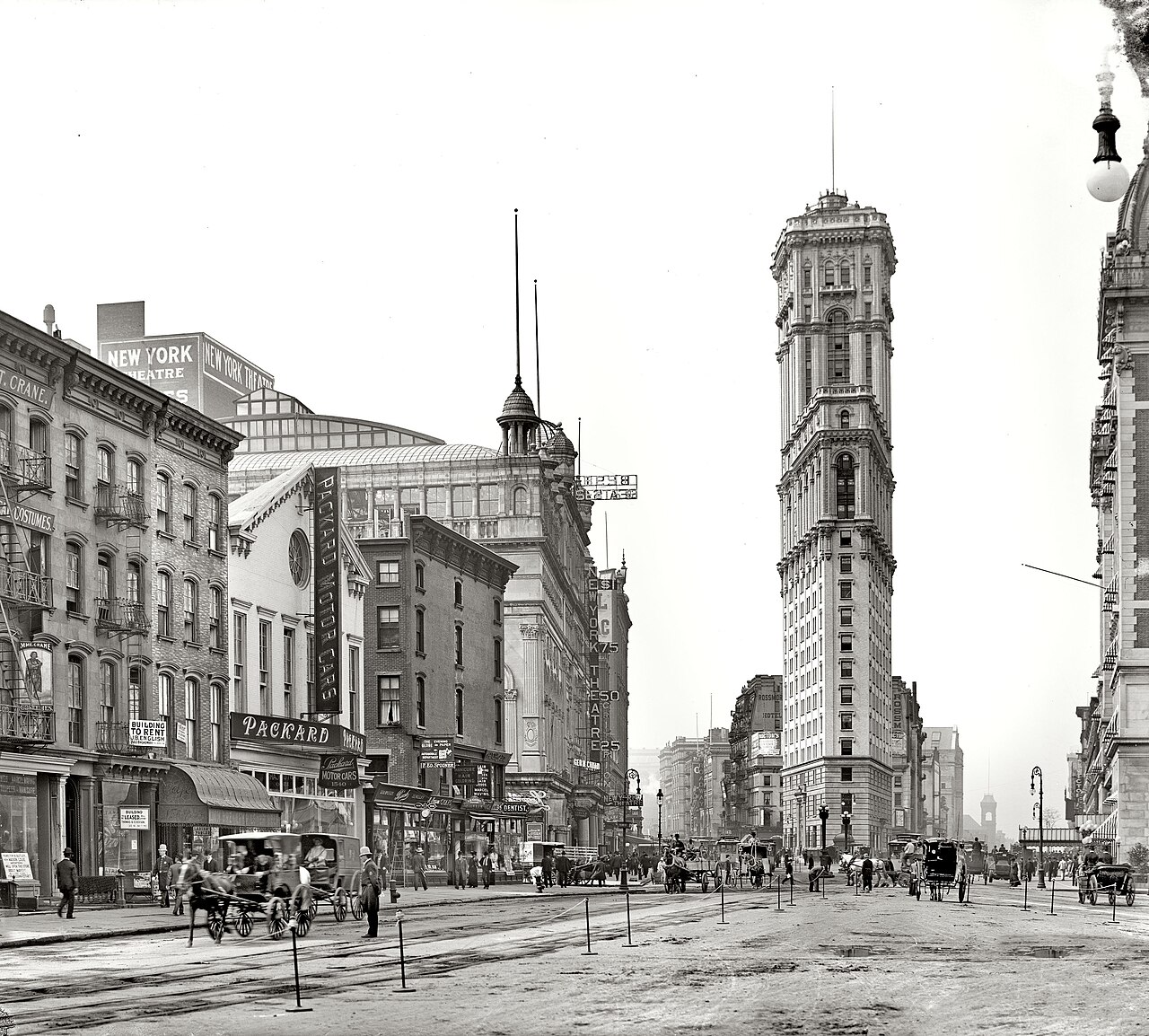 Longacre Square about 1904, looking north, with the narrow Times Tower rising at the right and horse-drawn traffic on the cobbled street