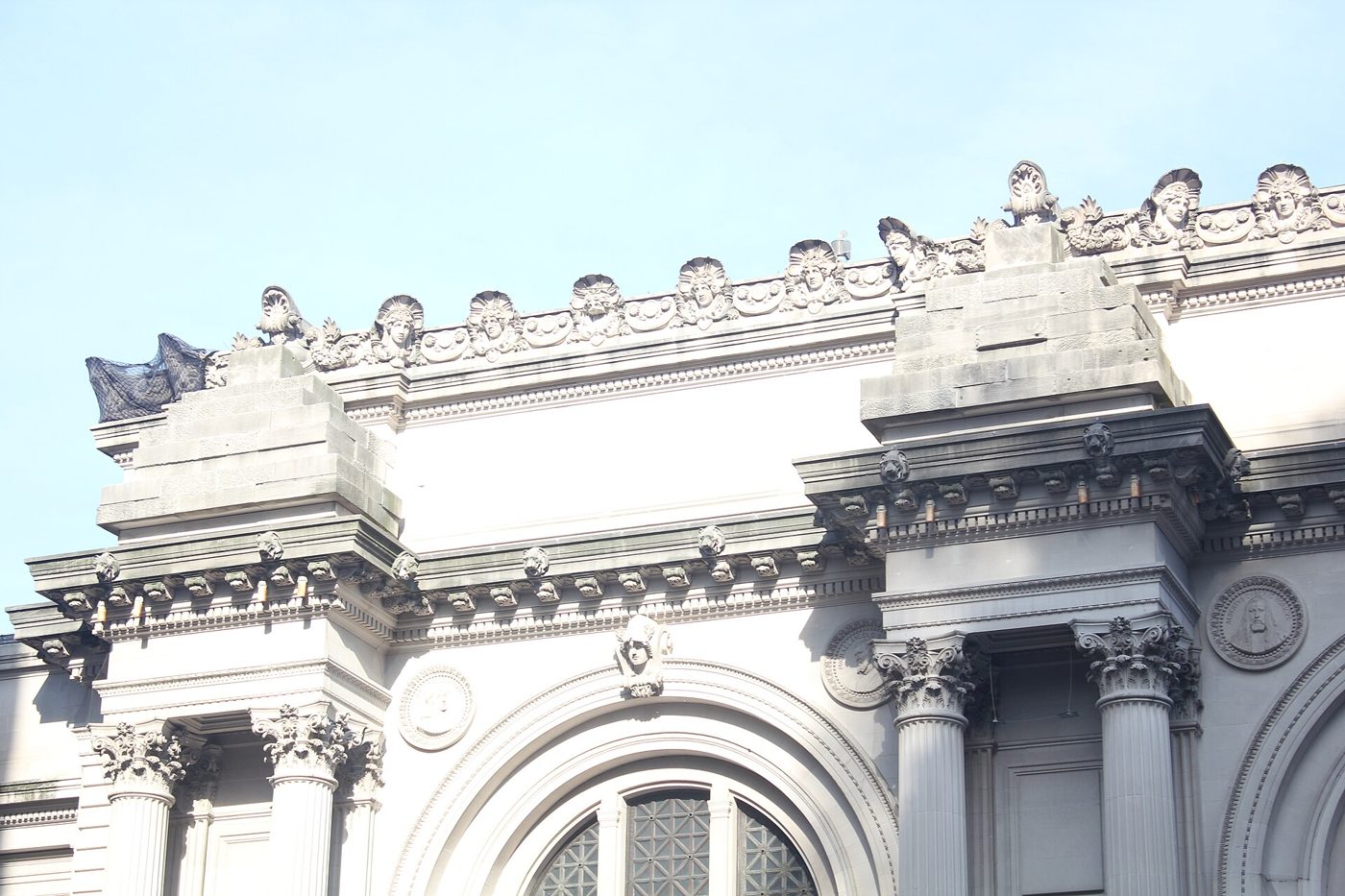 The Beaux-Arts Fifth Avenue facade of the Metropolitan Museum of Art with paired columns and arched windows