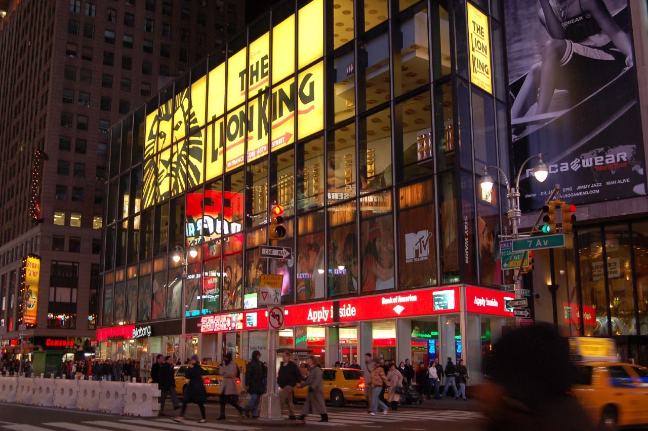 The Minskoff Theatre and Lion King signs lit at night on Times Square in Manhattan, 2007