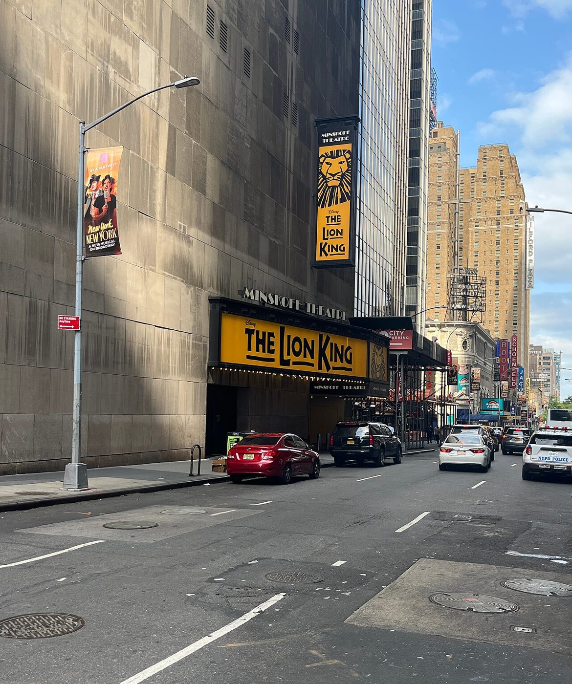 The Minskoff Theatre entrance with Lion King signs at the base of One Astor Plaza on West 45th Street in Manhattan, 2023