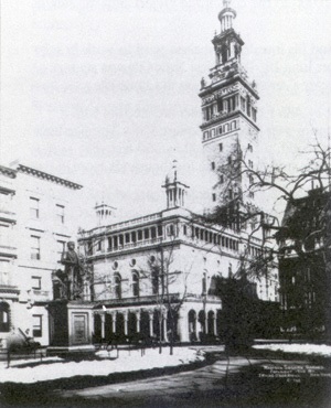 The second Madison Square Garden in 1890, a long low arena building with a tall Moorish tower modeled on the Giralda of Seville rising over Madison Square