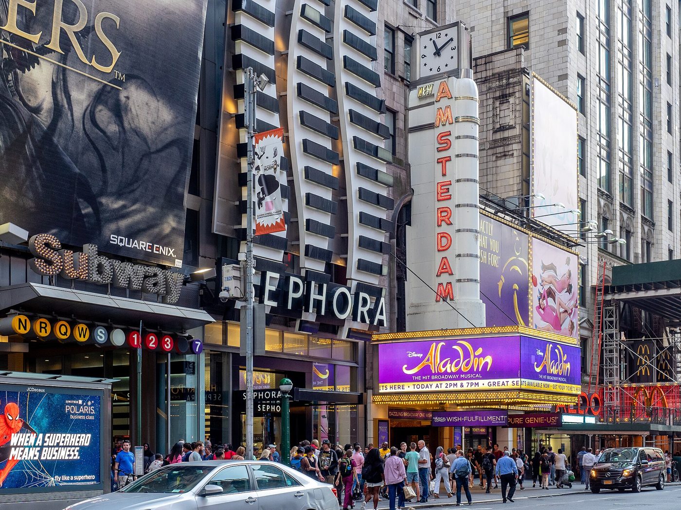 The New Amsterdam Theatre marquee and vertical sign for Aladdin on West 42nd Street in Times Square, Manhattan
