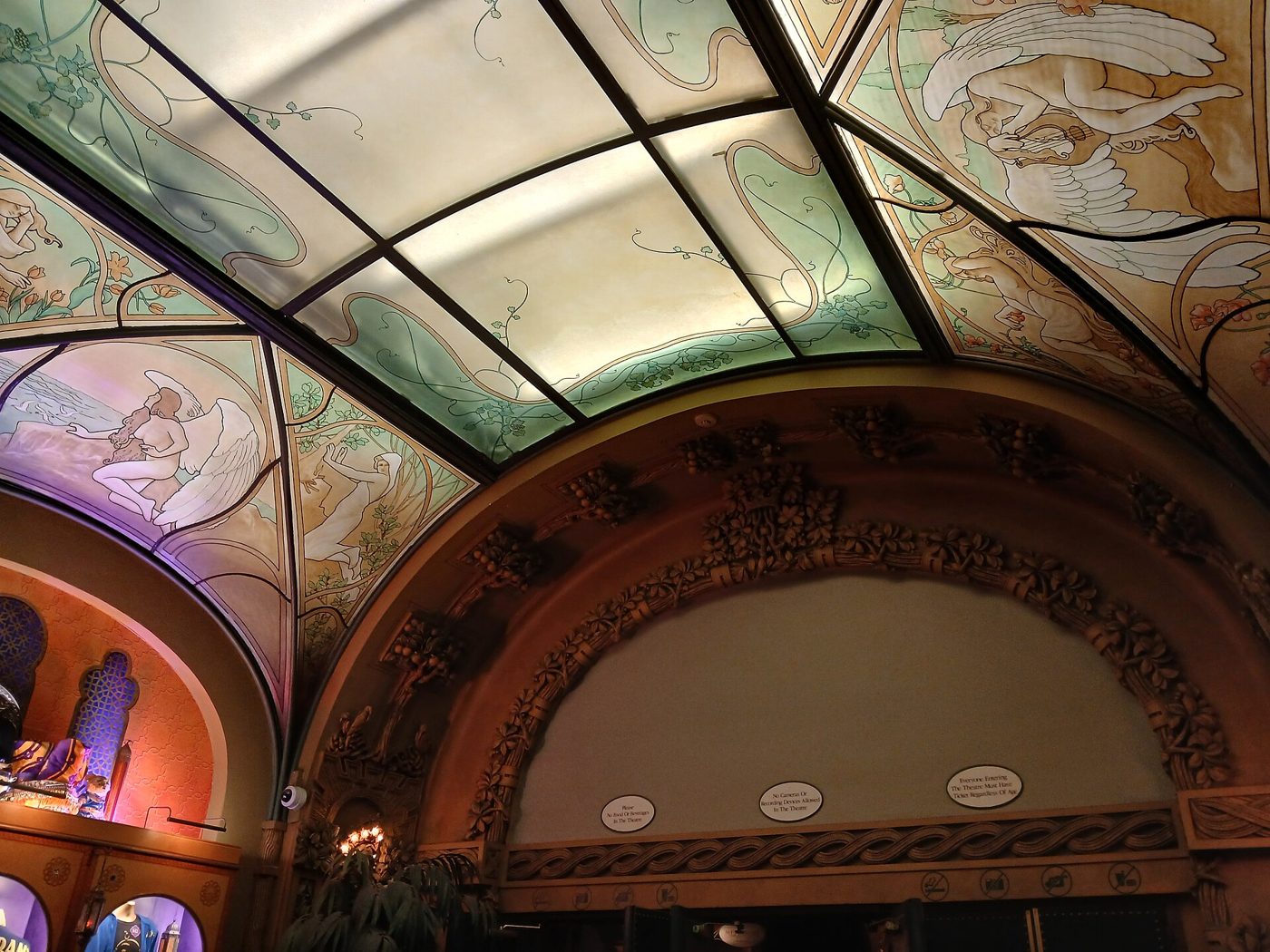 The stained glass and painted ceiling in the interior of the New Amsterdam Theatre in Manhattan in 2025