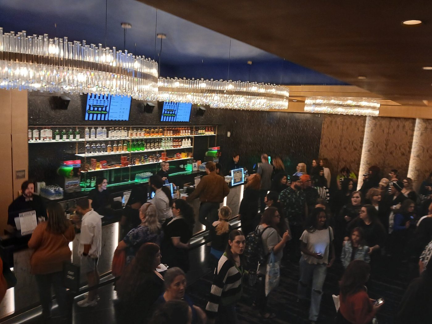 A crowded lobby bar at the Palace Theatre in Manhattan during an intermission, October 2025