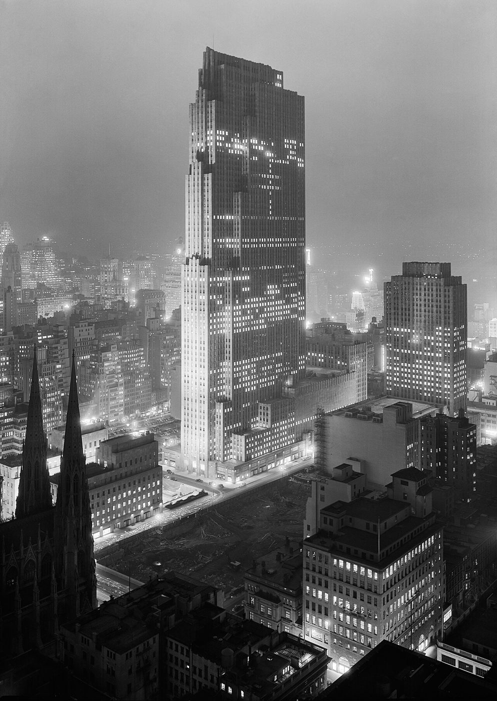 The RCA Building at Rockefeller Center lit at night in December 1933, seen from above