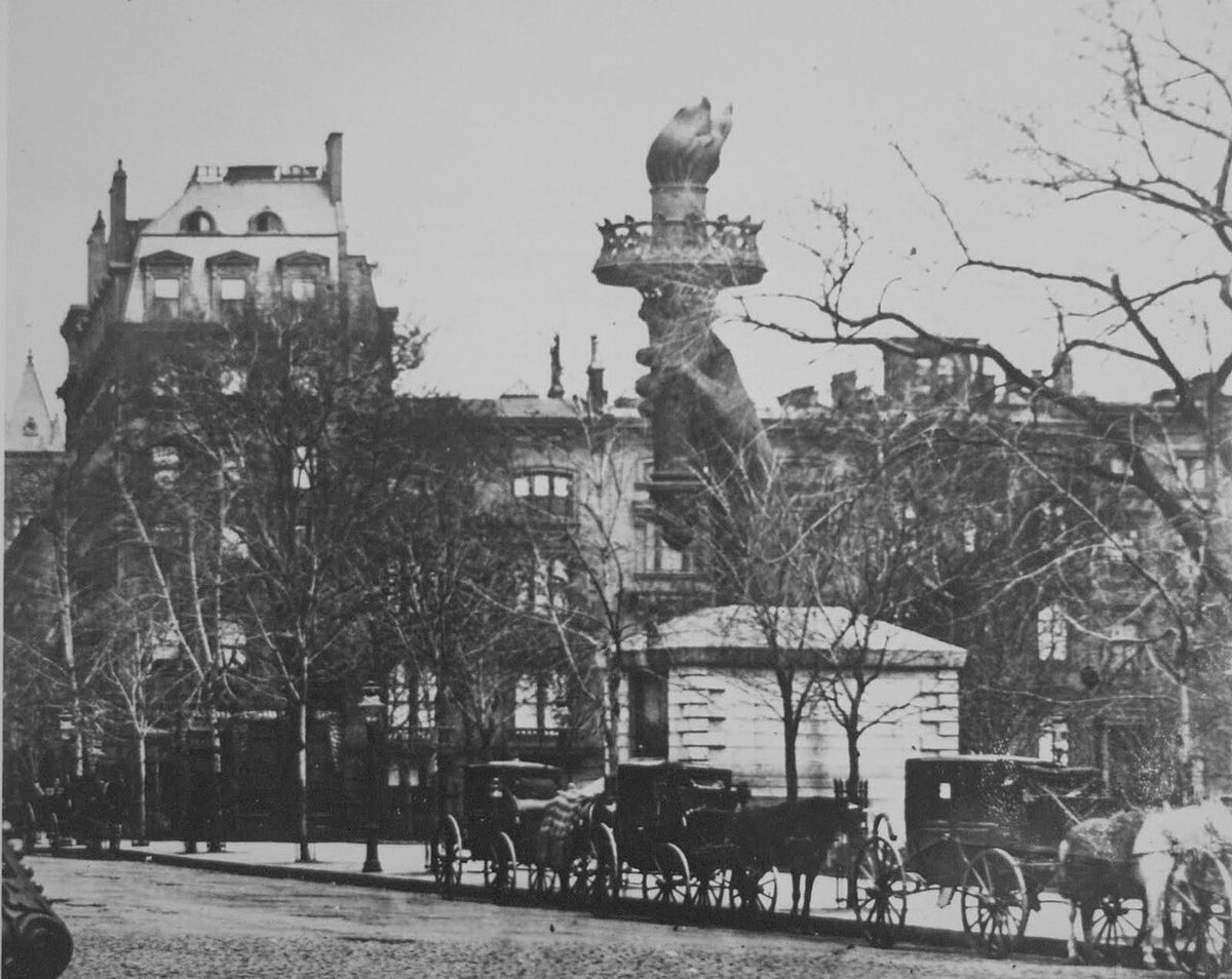 The arm and torch of the Statue of Liberty on display in Madison Square Park, New York, between 1876 and 1882