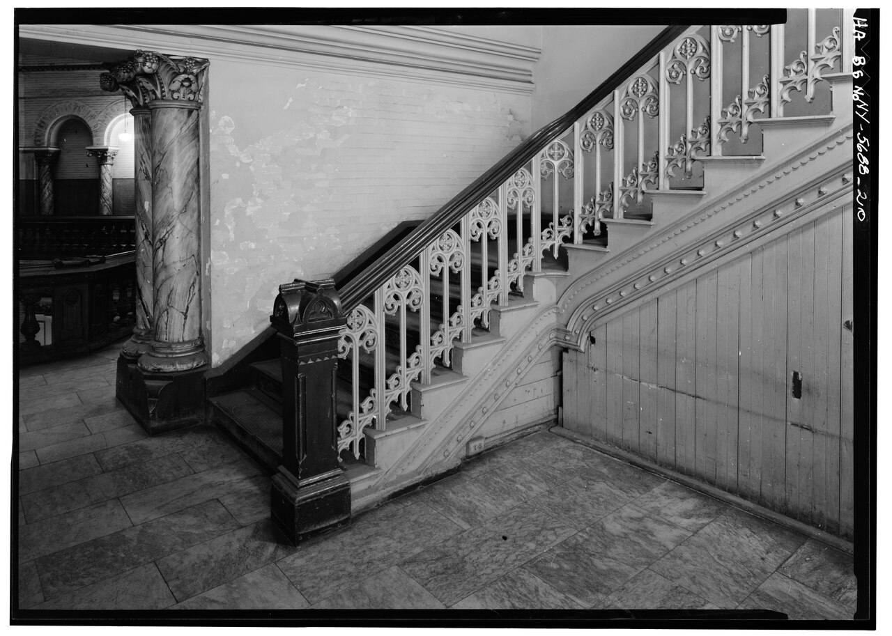 A stairway inside the Tweed Courthouse photographed by the Historic American Buildings Survey.