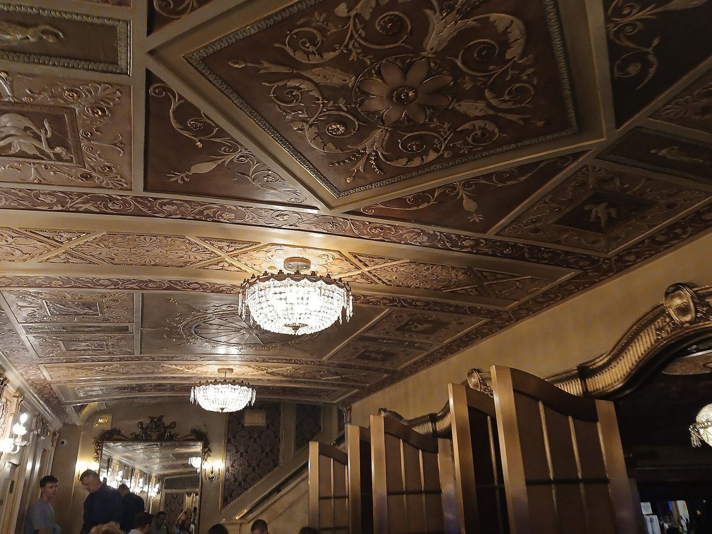 The ornamental plaster ceiling and a chandelier inside the Winter Garden Theatre in Manhattan, August 2025