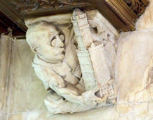 Lobby carving of Cass Gilbert holding a model of the Woolworth Building.