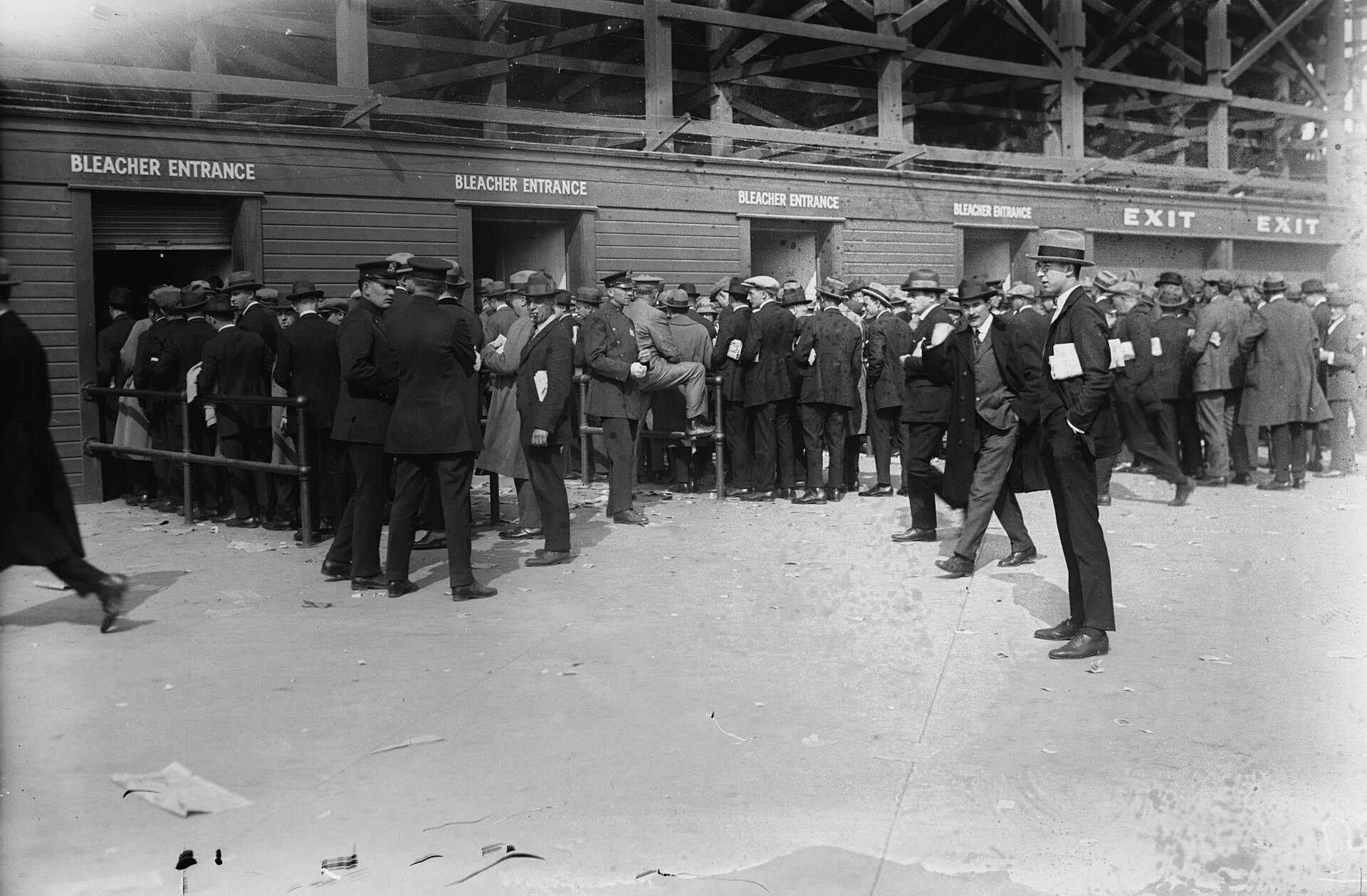 Fans in 1920s coats and hats lined up outside the bleacher entrance of the original Yankee Stadium for Game 1 of the 1923 World Series