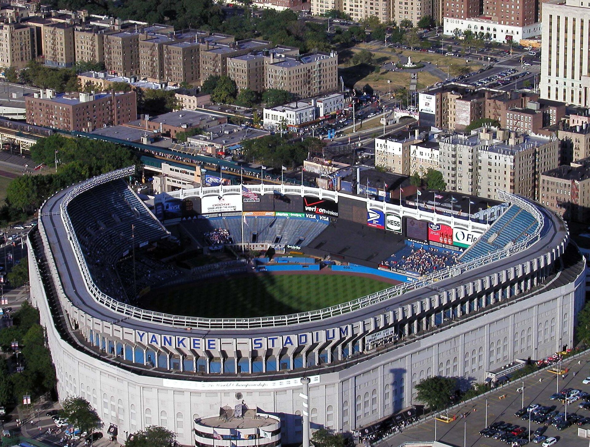 Aerial view of the renovated original Yankee Stadium in 2002, a white-walled ballpark surrounded by Bronx apartment blocks