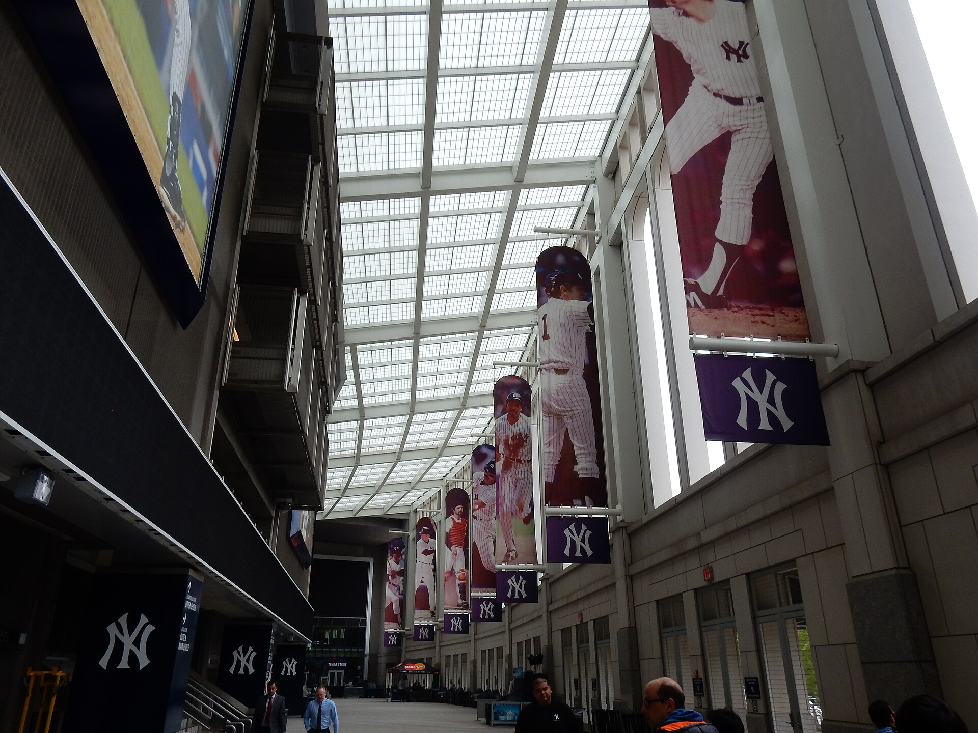 The Great Hall, the stadium's tall main concourse with banners of Yankee greats hanging above the crowd