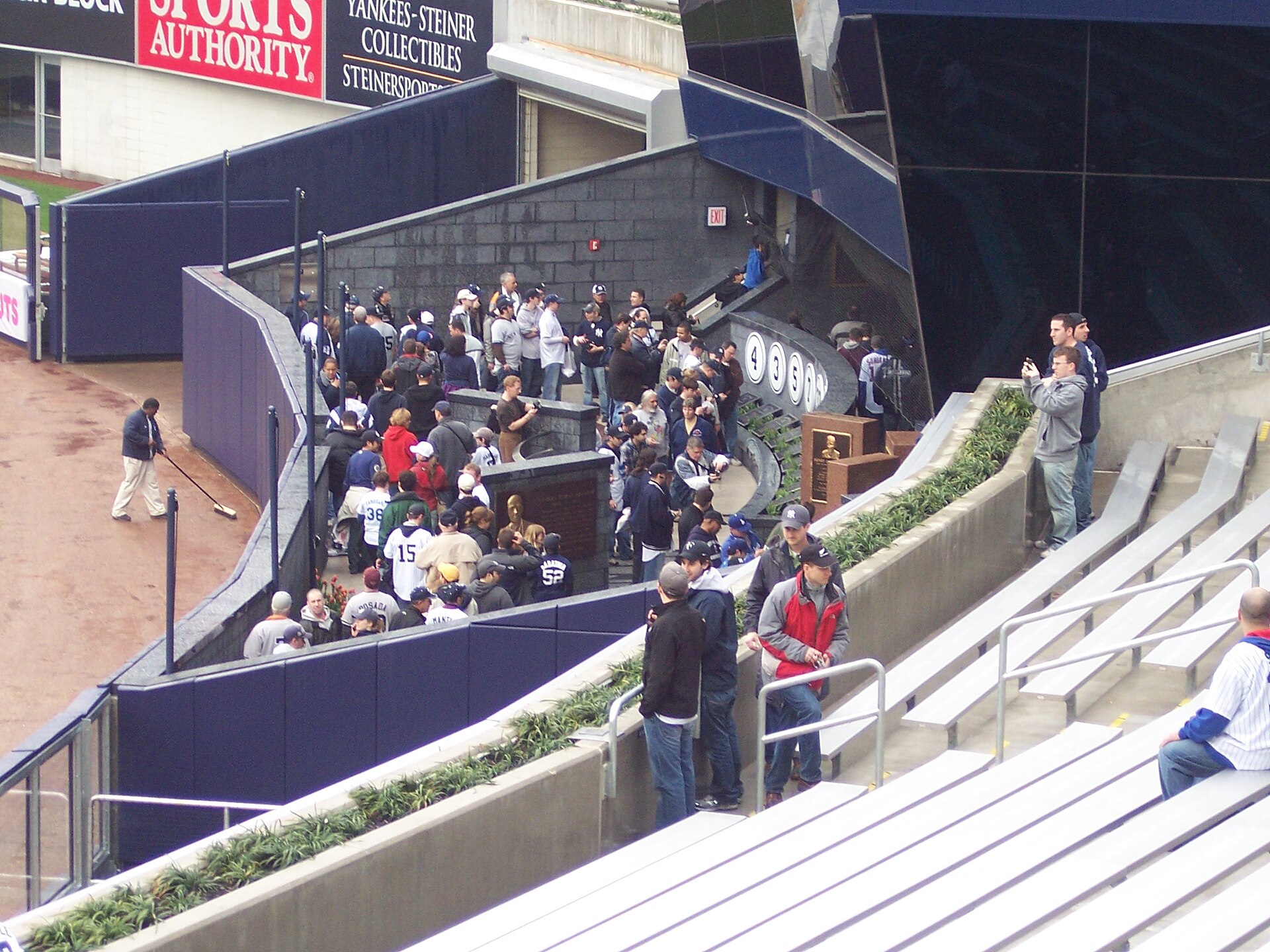 The monuments and plaques of Monument Park beyond the center-field wall, seen from the bleachers